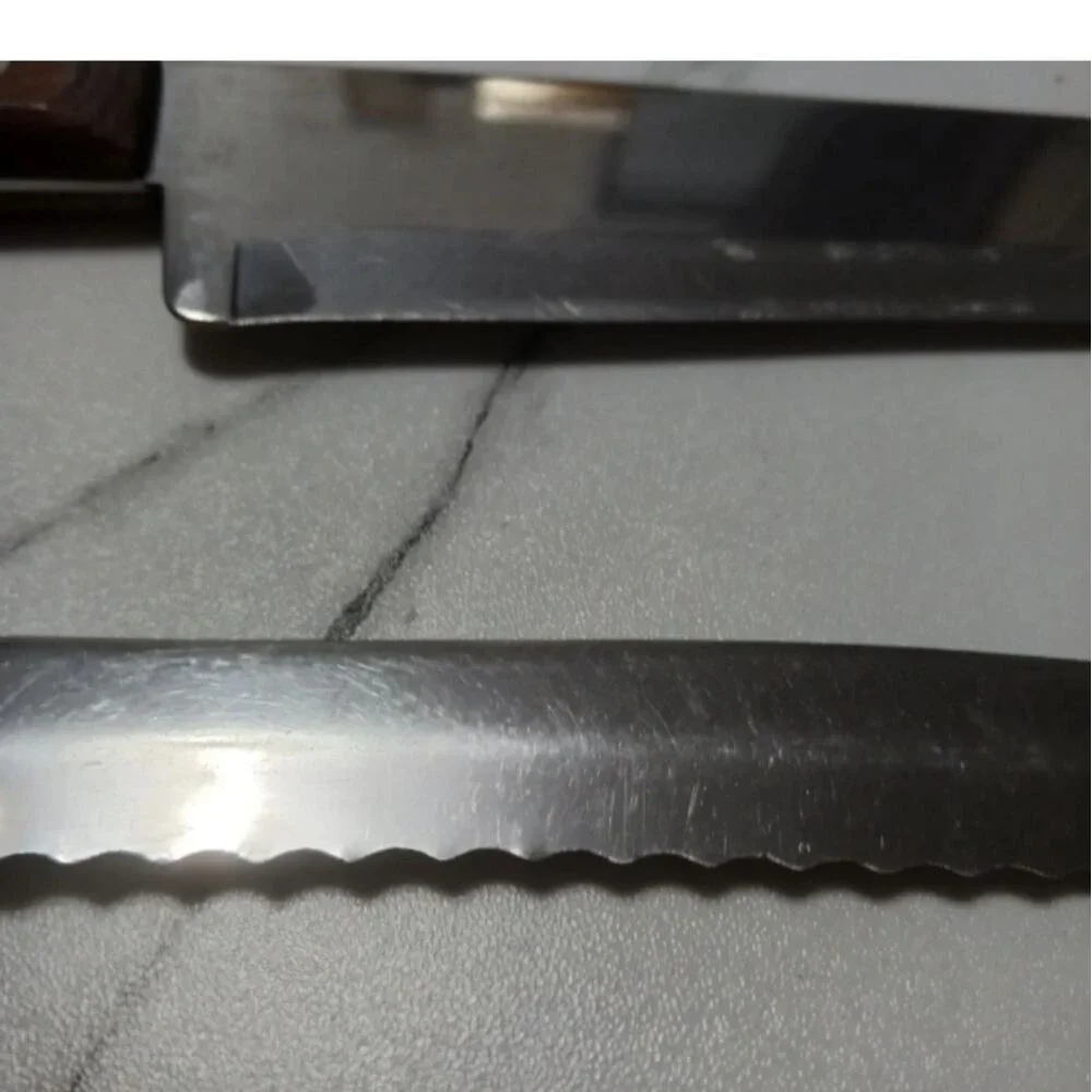 Pair of stainless steel Knives by Flint made in USA Surface scratches Partial